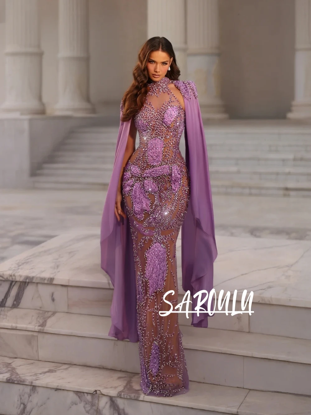 

Luxury Form-Fitting Mermaid Prom Dress With Heavy Crystal Beading & Cape Sleeves Sheer Nude Mesh High Neck Lavender Evening Gown