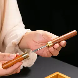 Stainless steel ice pick, kitchen tool with wooden handle and sheath.