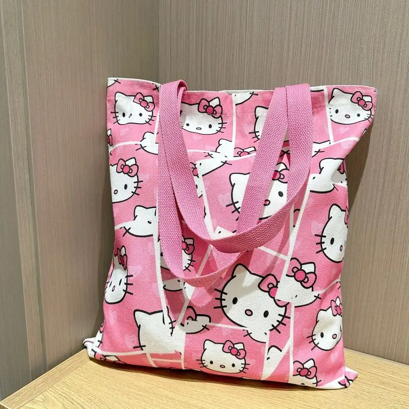 Hello kitty 2025 new canvas bag cute KT cat large-capacity students carrying shoulder bag cartoon handbag commuting bag to work