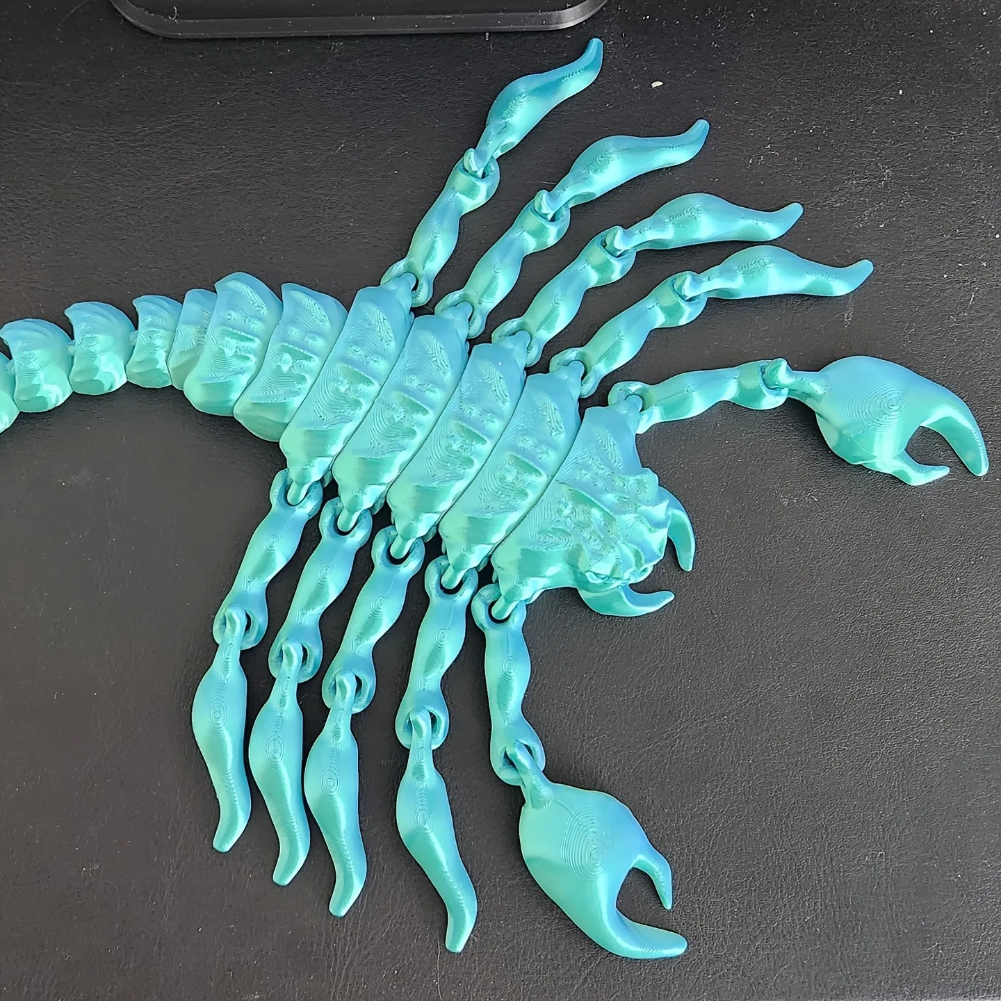 A 3D-printed gradient-colored scorpion figurine, suitable for home decoration or office decoration