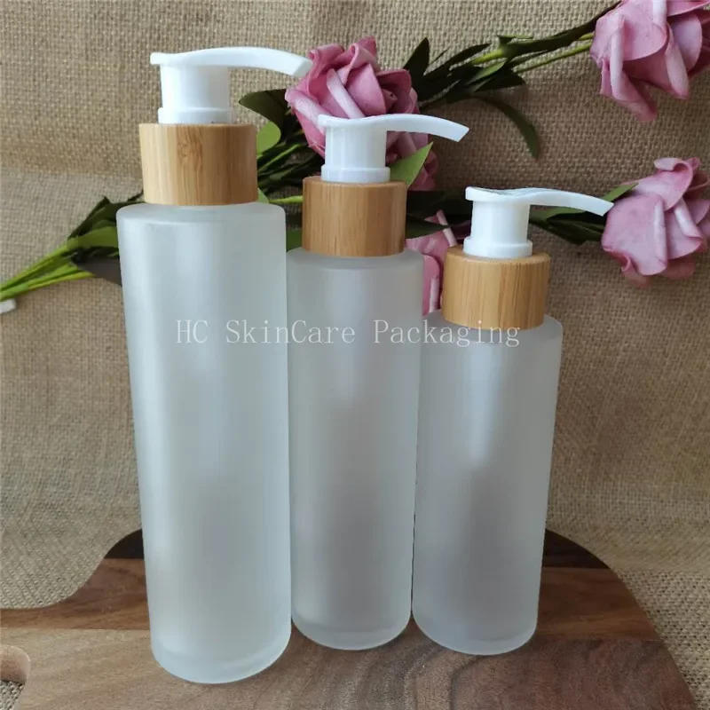 

Whoelsale high quality Matte Glass Bamboo Cap Lid Lotion Pump Glass Bottles Cosmetic Container Packaging soap Shampoo Bottle