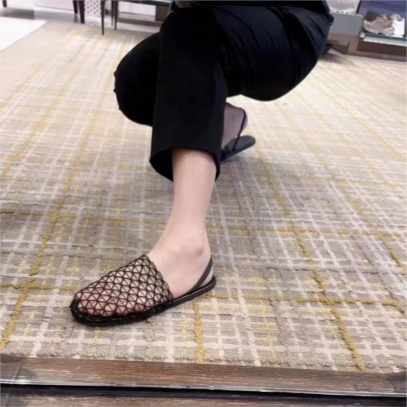 

Fishnet weaving hollow Roman sandals female summer new fisherman flat bottom round head Baotou half slippers