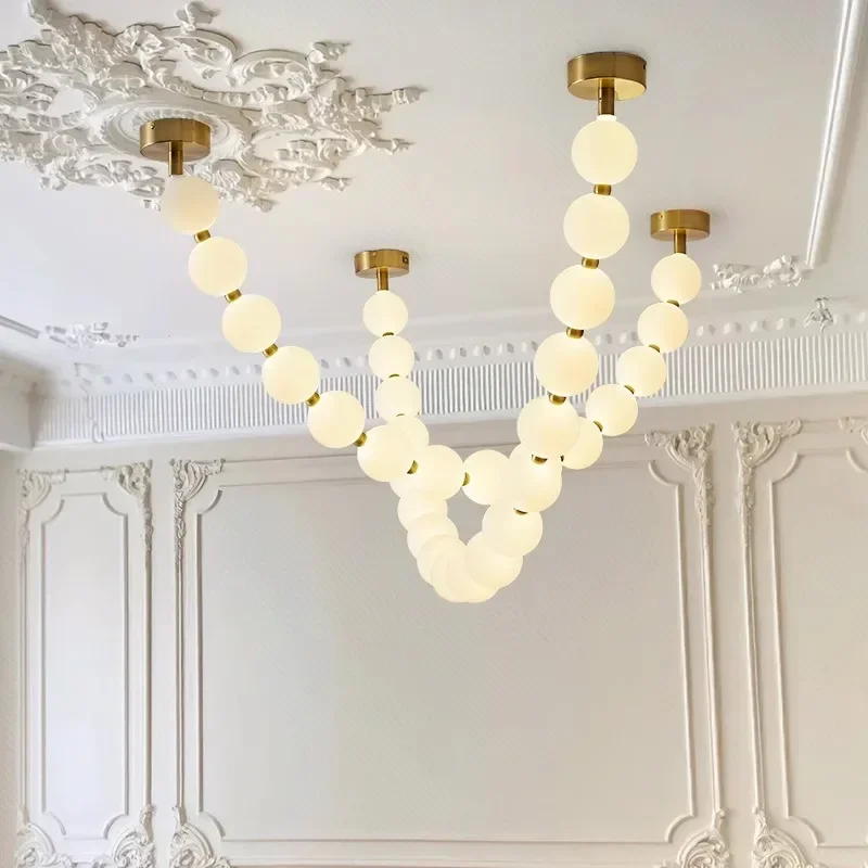 Buddha bead duplex staircase pendant light，Nordic modern minimalist designer restaurant bar table lamp, long necklace lamp