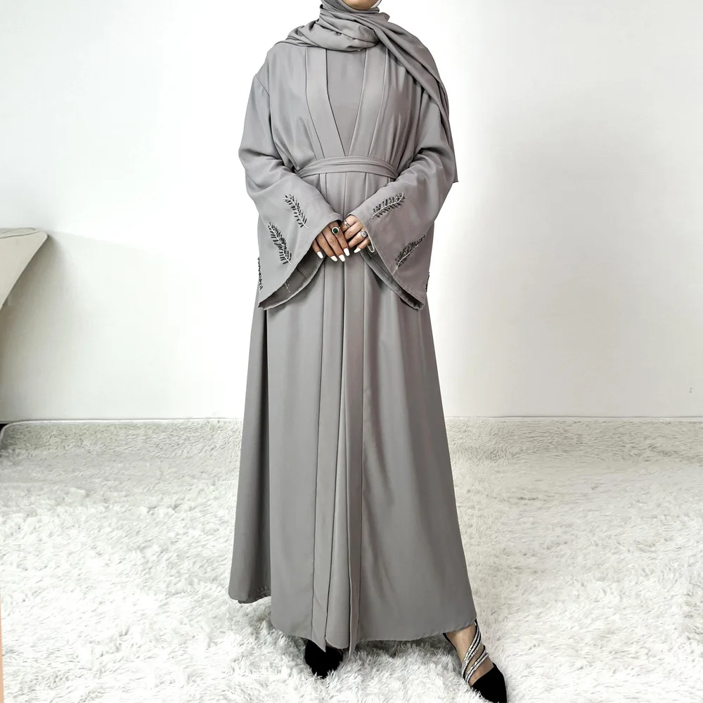 

Fashionable Abaya dress with tube beads and hot-fixed rhinestones. It is an Arab women's Muslim robe set without a headscarf.