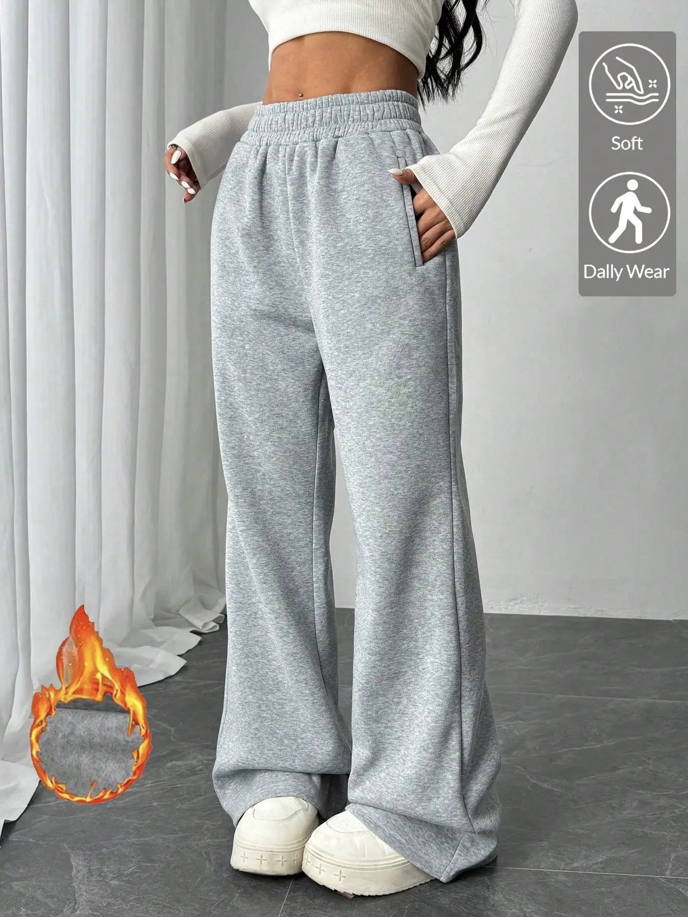 

Женские светло-серые свободные расклешенные спортивные брюки с эластичным поясом и карманами