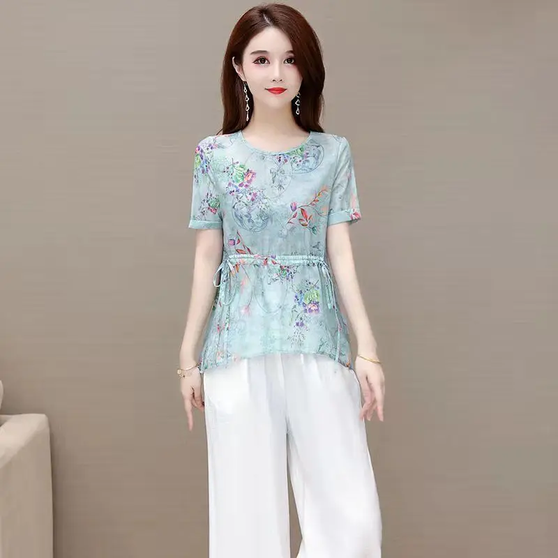 

Женский летний комплект 2026 года: Новинка, состоящая из двух предметов, с принтованными широкими брюками, стильный, стройнящий, подчеркивающий фигуру, омолаживающий образ