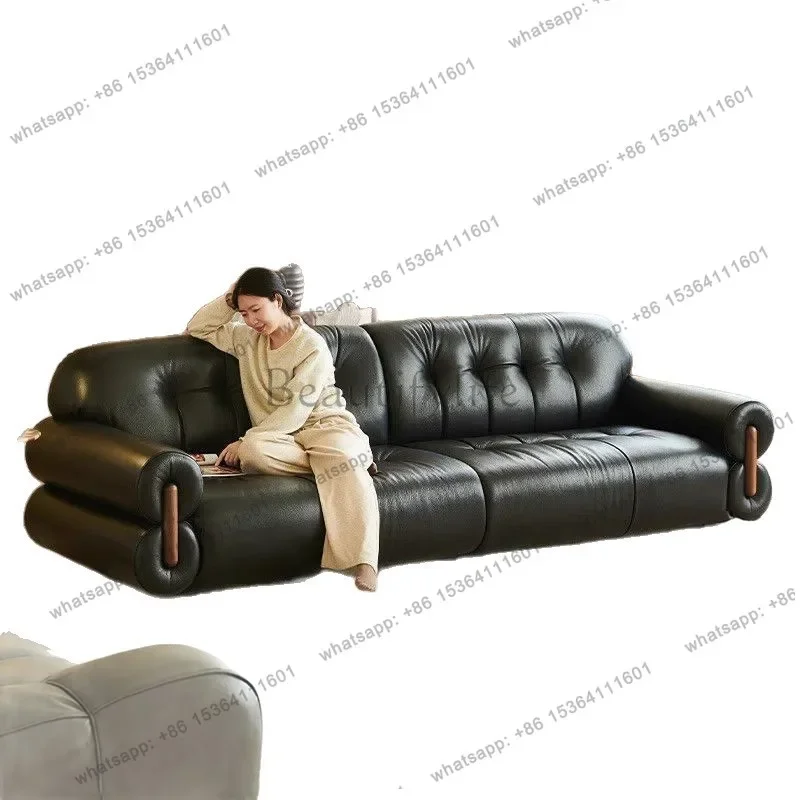 

56The medieval cherry wood leather sofa is in-line in the living room, light luxury Italian