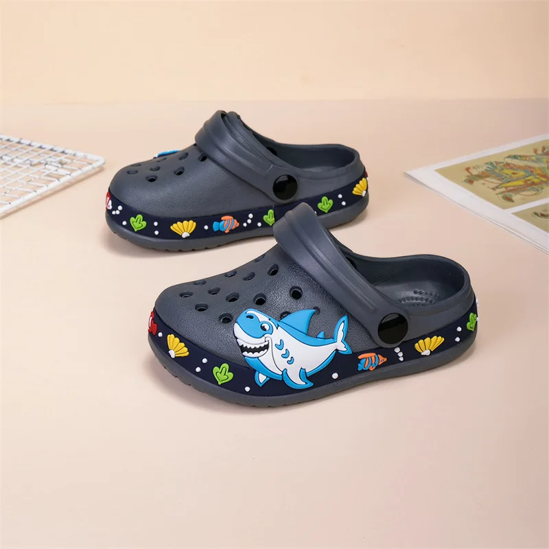 

A pair of children's summer slip-on shoes with cartoon shark decoration and anti-slip soft sole. Outdoor sandals. Model:NDF-2188