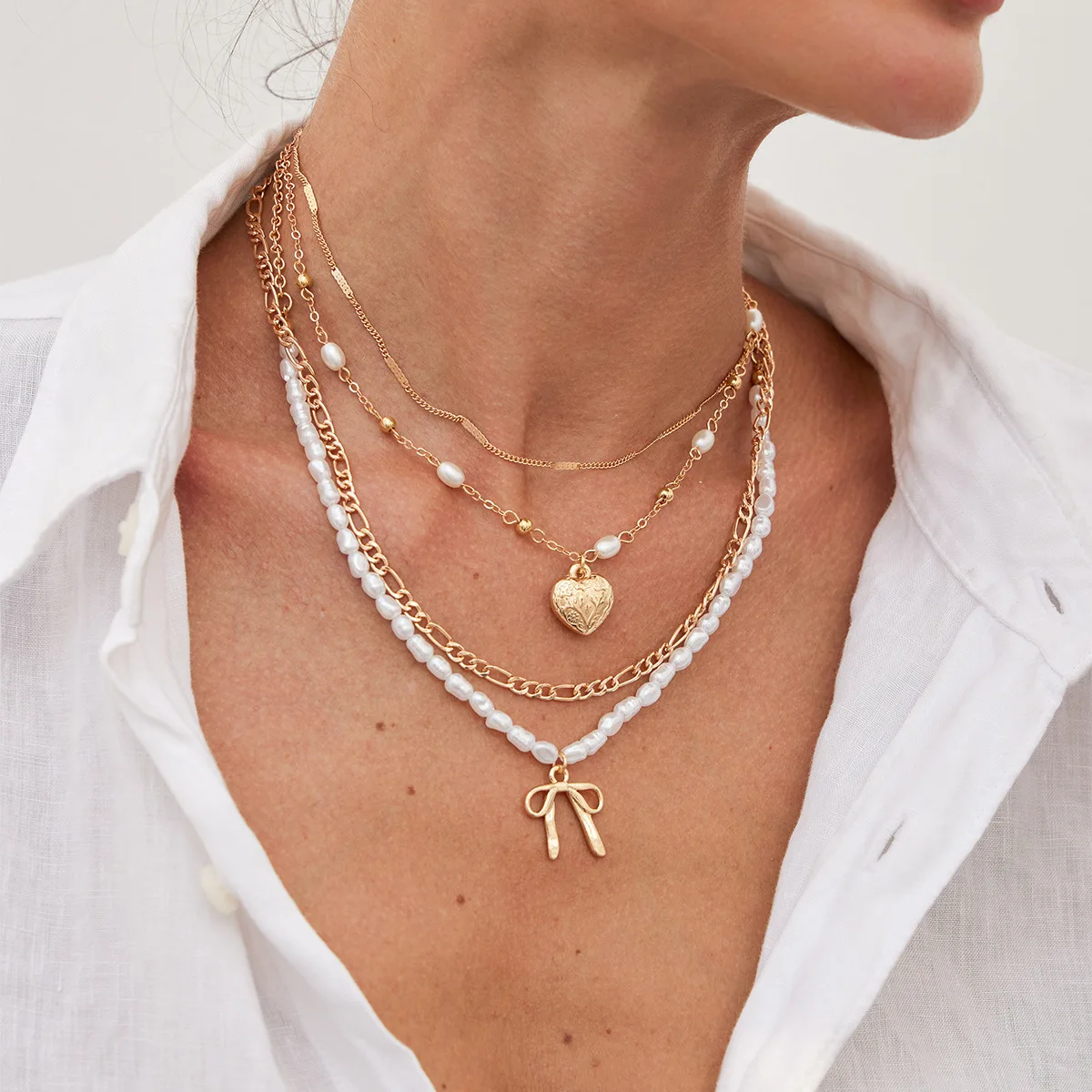 Wind multi-layer stacked necklace women's long high-end love bow necklace cross collarbone chain