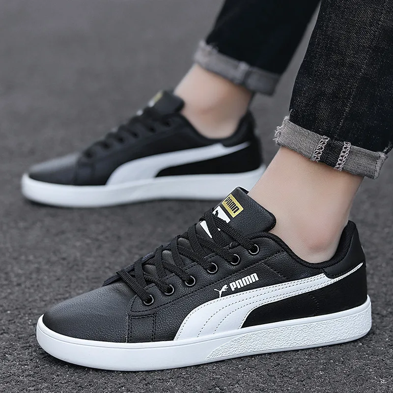 Zapatos informales Unisex de cuero de caña baja, zapatillas deportivas impermeables, zapatos de tablero plano para parejas de hombres y mujeres de estilo coreano