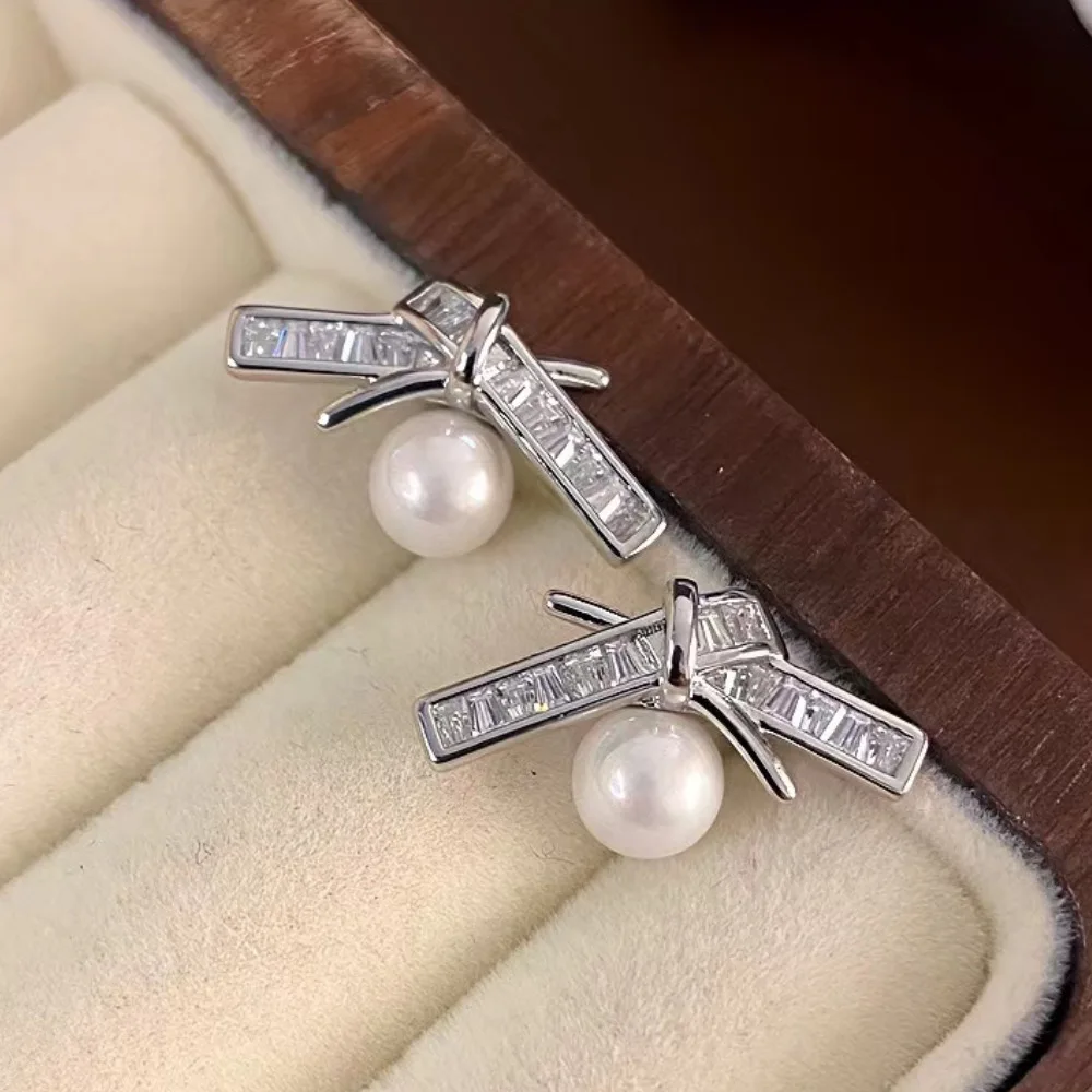 

Fashionable and cute bow earrings. Fashionable women's earrings, popular accessories for Japanese and Korean fashion influencers