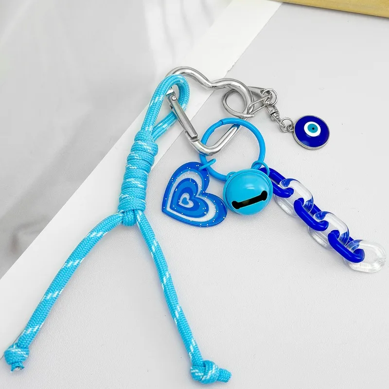 

Женская бусина от сглаза с плетеным шнуром, брелок для ключей в богемном стиле, кошелек, брелок для ключей - прочный пластик/смола/декоративная ткань