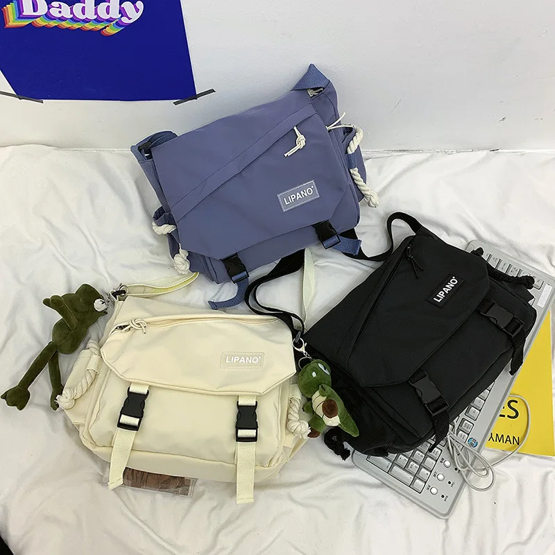 Borsa a tracolla da donna Borsa a tracolla da uomo di grande capacità Coreano giapponese Harajuku JK Borsa a tracolla per studenti in tela di moda