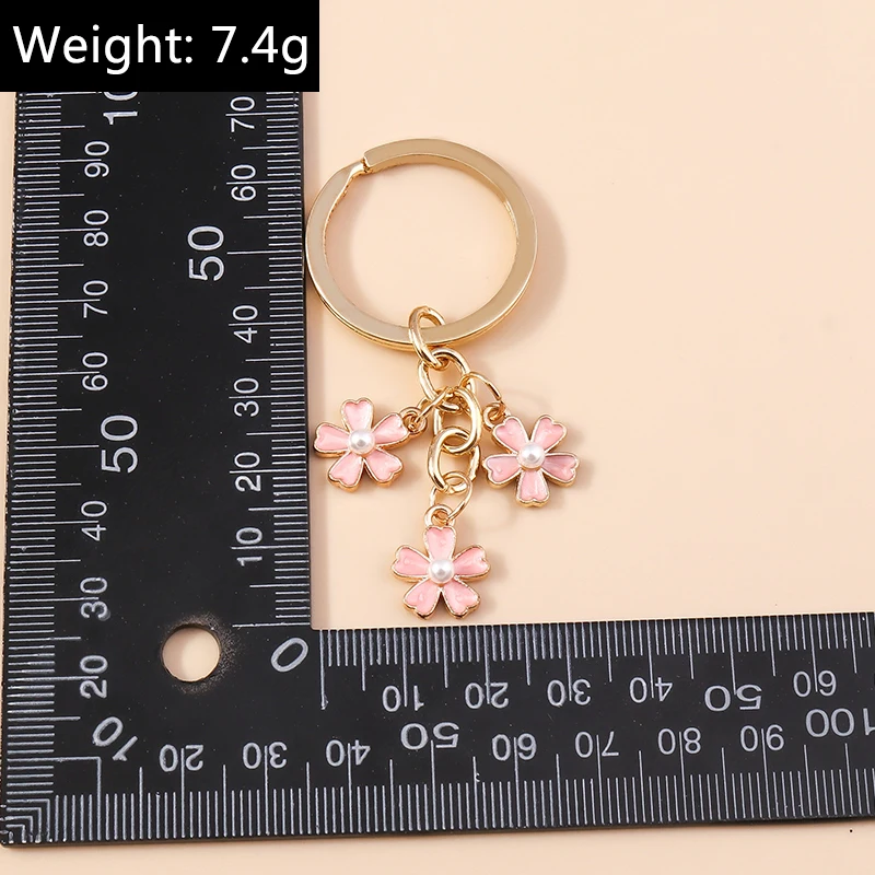 Aihua 40 Farben Niedlicher Pflanzen-Schlüsselanhänger Emaille Sakura-Blumen-Schlüsselanhänger für Frauen Mädchen Handtasche Anhänger Autoschlüsselhalter DIY Schmuck Geschenke – Detail 31
