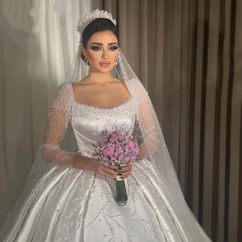 

Свадебное платье 2026 года на заказ: белое, с V-образным вырезом, жемчугом и кружевом, фасон «балл-граунд», длина в пол, со шлейфом, на шнуровке