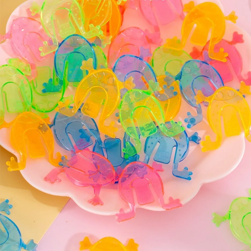Regalo in plastica che salta rana colore casuale che rimbalza divertente rana trasparente/colore solido
