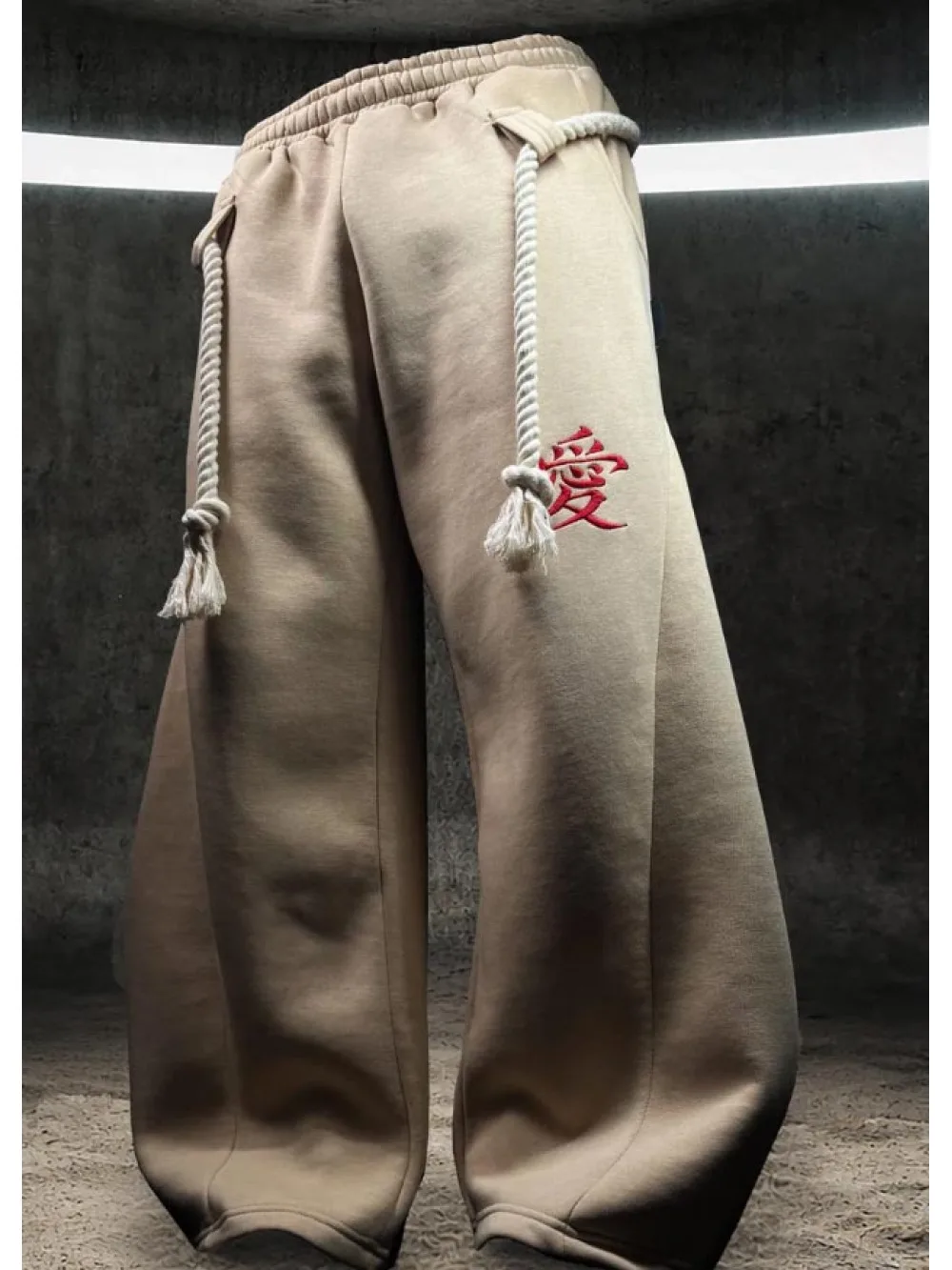 Unisex retro subculture wide leg pants with curved knife pattern and hemp rope decoration, elastic waist high street pants