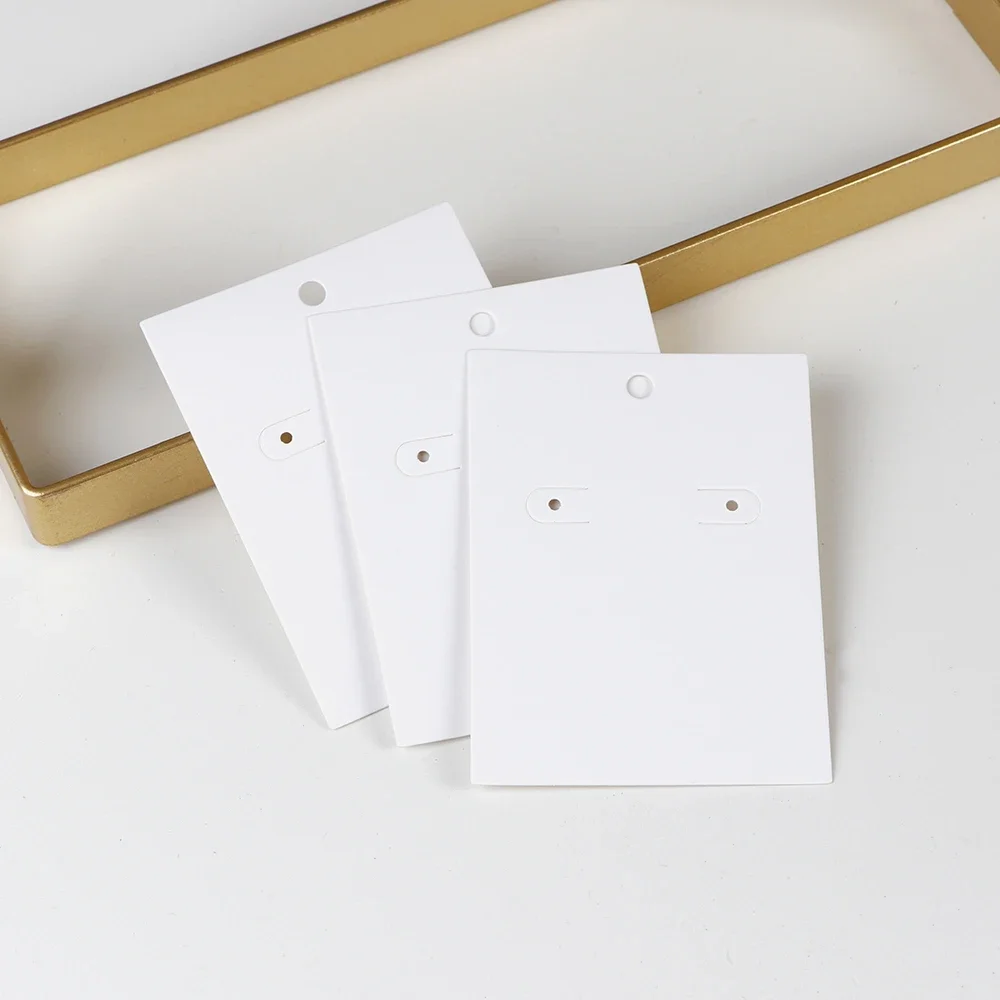 50 pz 5.5x7.5cm nuovo modello bianco collana orecchini gioielli Display carte di carta Kraft con o senza sacchetti imballaggio all'ingrosso