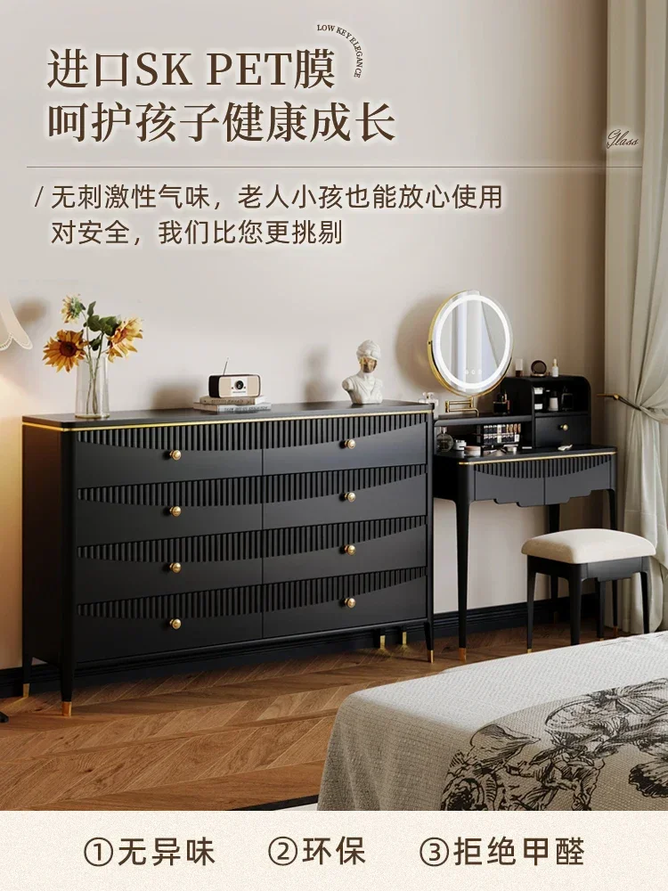 Modern living room side cabinet with black four or five drawers against the wall, storage hopper cabinet