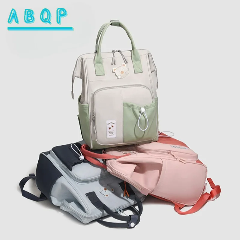 nouveau-sac-a-dos-pour-couches-de-marque-de-luxe-motif-dessin-anime-mignon-grande-capacite-tendance-portable-haute-qualite