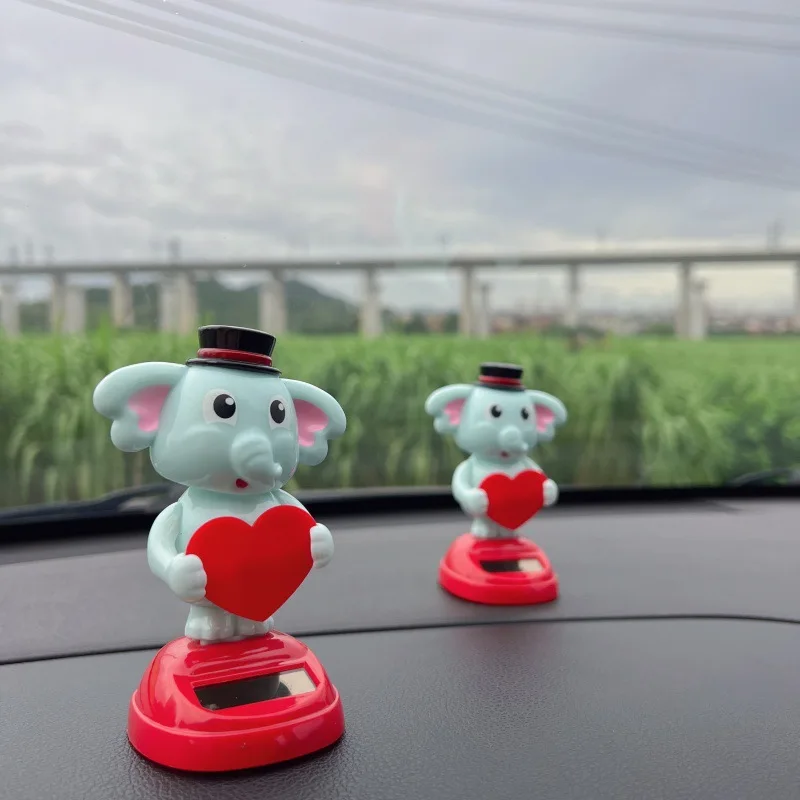 

Solar car shaking head ornament, cute elephant dynamic decoration, center console roof dual-purpose, creative interior