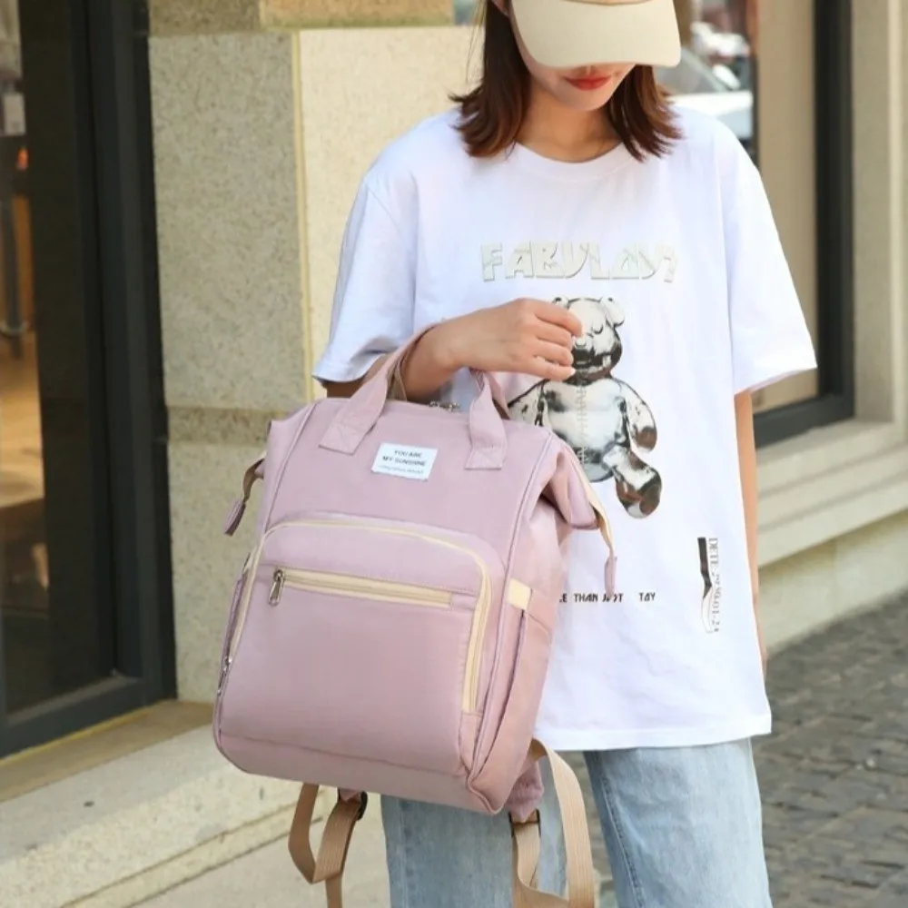 กระเป๋าคุณแม่แบบพกพา ความจุขนาดใหญ่ กระเป๋าเป้สะพายหลังอเนกประสงค์สำหรับใส่ผ้าอ้อม น้ำหนักเบา พับเก็บได้ กระเป๋าสำหรับคุณแม่ไปเที่ยว ผู้หญิง