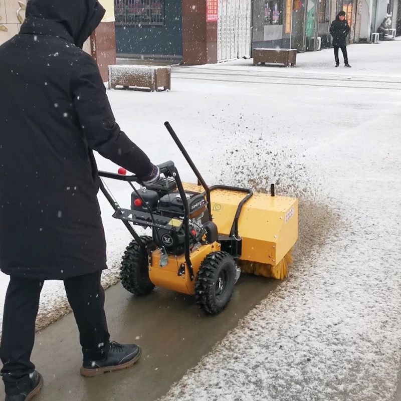 

All-Terrain Hand-Pushed Snow Thrower With Pneumatic Tires And Reinforced Scraper Bar For Uneven Pavements