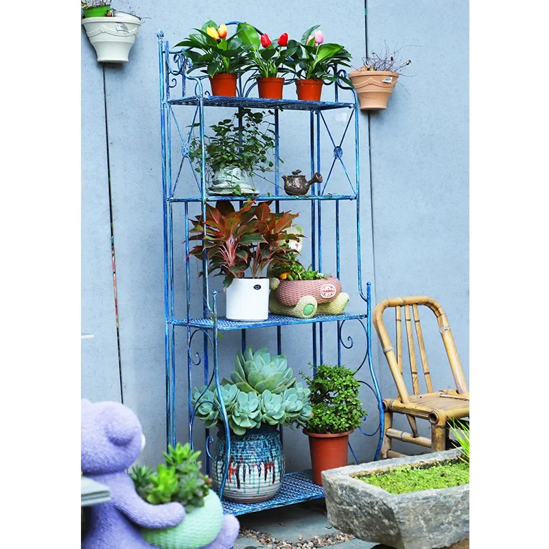 Retro and old outdoor wrought iron multi-layer shelves, green plant flower stands, balconies, gardens, courtyards, flower