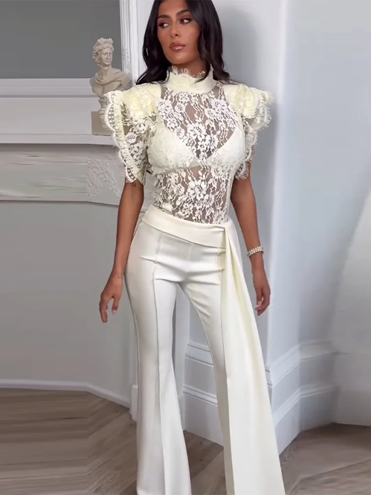 

﻿ Элегантный кружевной комплект: блузка с рюшами и прозрачными рукавами, атласные расклешенные брюки. Женский повседневный шикарный костюм 2026.