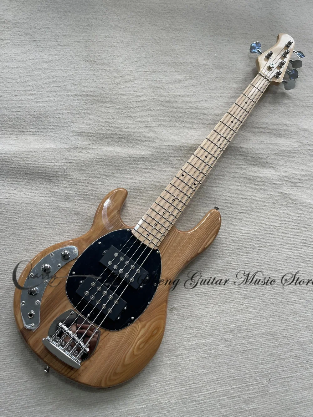 Left-handed bass, 5-string natural bass, Ash wood body, bridge, black pickup plate, chrome hardware. view 2