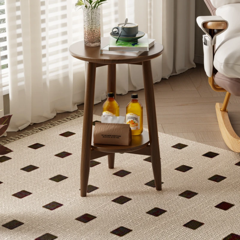 

A small round table next to a solid wood sofa, a small coffee table for storage in the living room