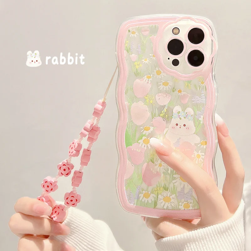 

Suitable for wave-edged floral bunnyiphone13Phone case15promaxApple11SiliconexsPink Lanyard14
