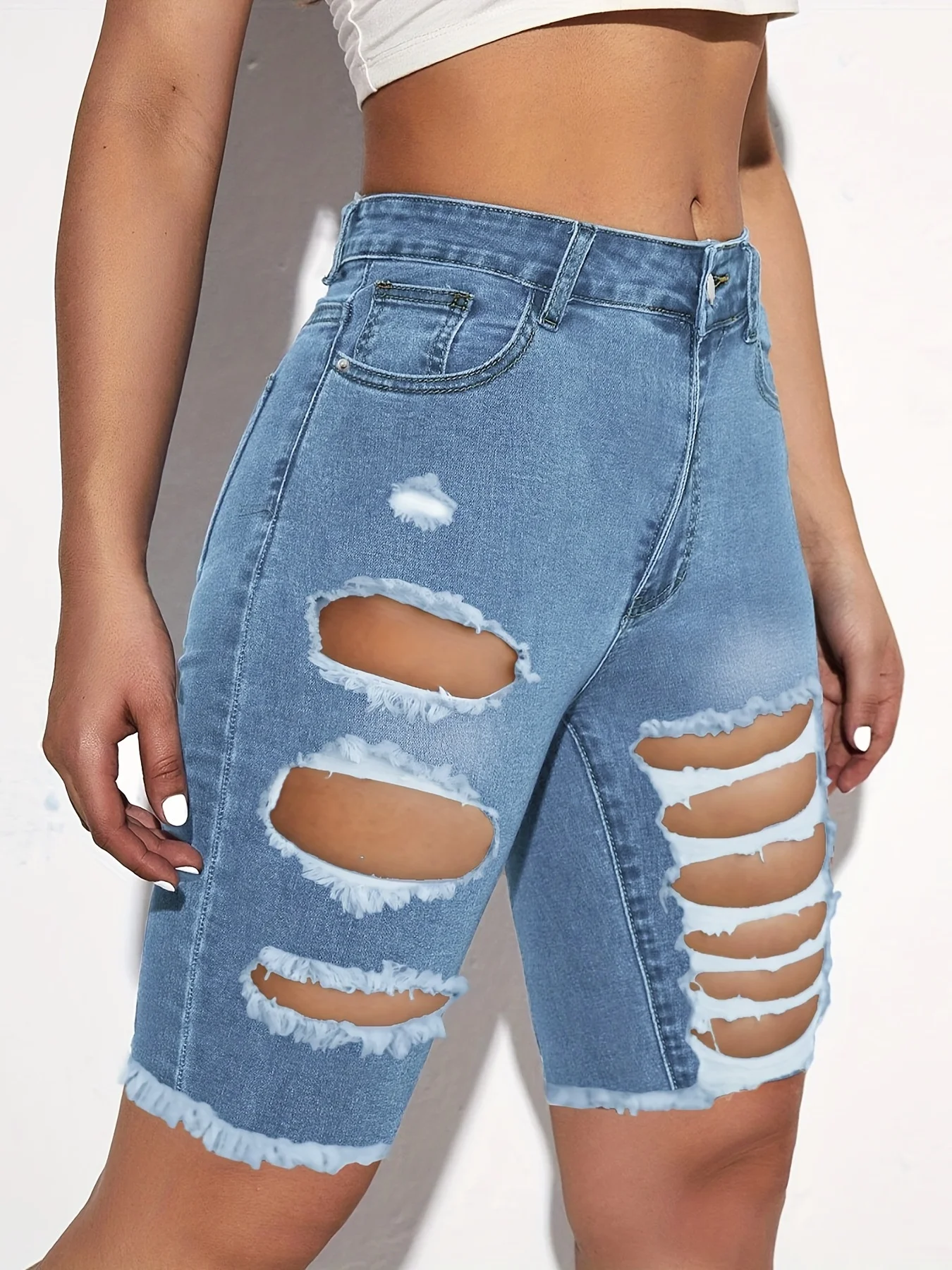 Women\'s fashion jeans with holes in them