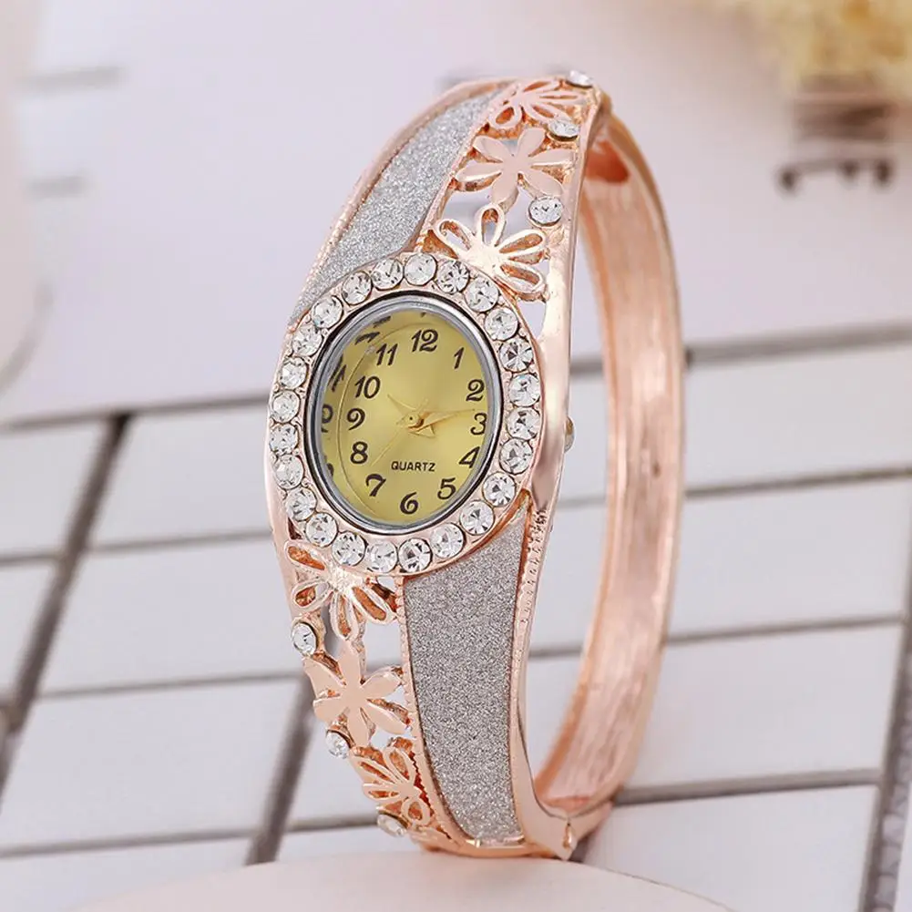 

Top Luxury Women Bangle Watch Rhinestone Hollow Flower Band Fold-over Clasp Oval Dial Analog Quartz Wrist Watch Reloj De Mujer