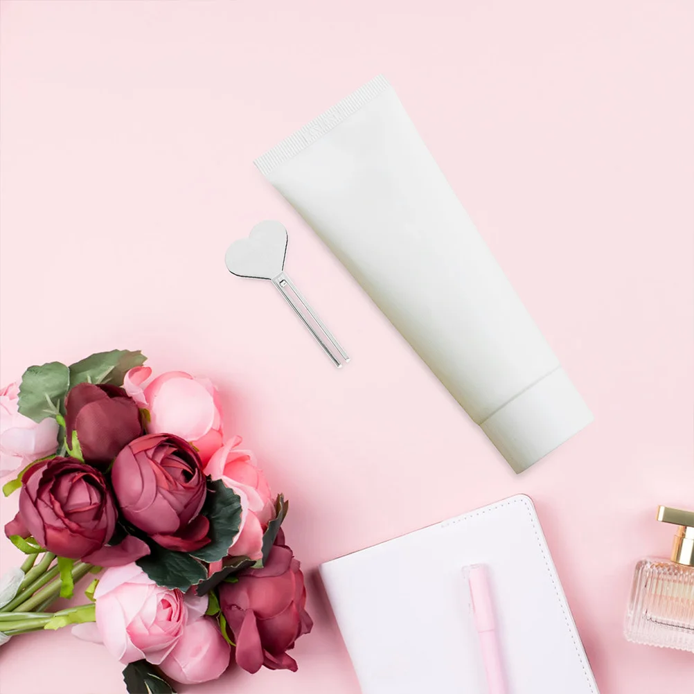 Exprimidores de pasta de dientes, herramienta exprimidora de tubo de Metal de aleación de Zinc para baño, tubo dispensador compacto en forma de corazón para uso doméstico, 4 Uds.