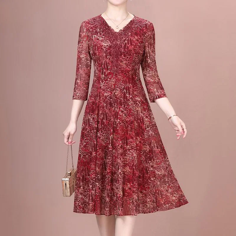 Ropa elegante para mujer, vestido acampanado de longitud media con estampado elástico, manga tres cuartos de encaje de retales con cuello en V, moda de verano ZT2