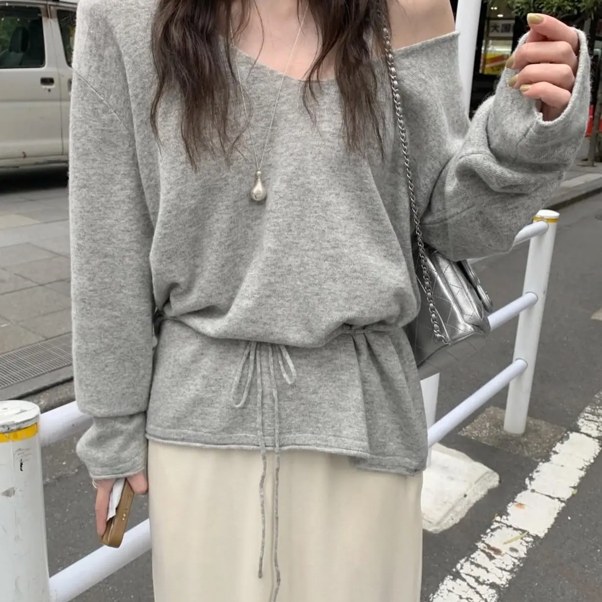 Loose Korean Style V-Neck Shoulder Bared Knitwear Women's Long Sleeve Drawstring Waist Slimming Top for Autumn Season