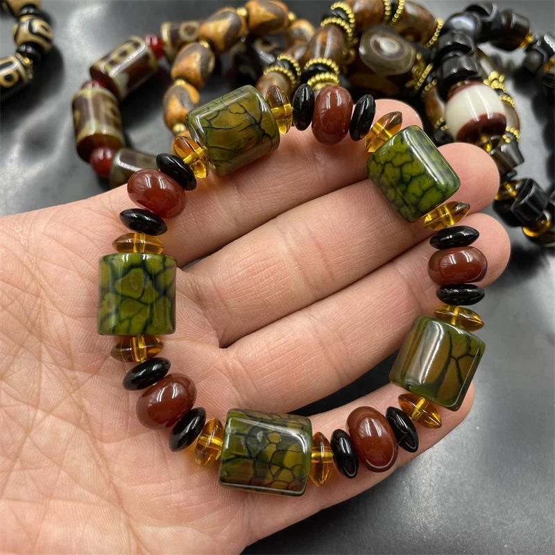 Tibetan-style vintage ivory-colored nine- dzi bracelet with three-eye tube and old agate beads