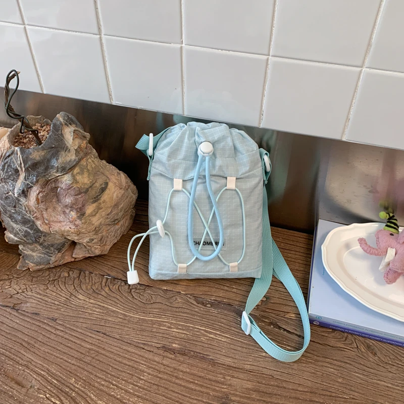 

Nylon Solid Color Versatile Crossbody Bags Korean Style Plaid Mini Bucket Bag Drawstring Nylon Crossbody Shoulder Bag for Women