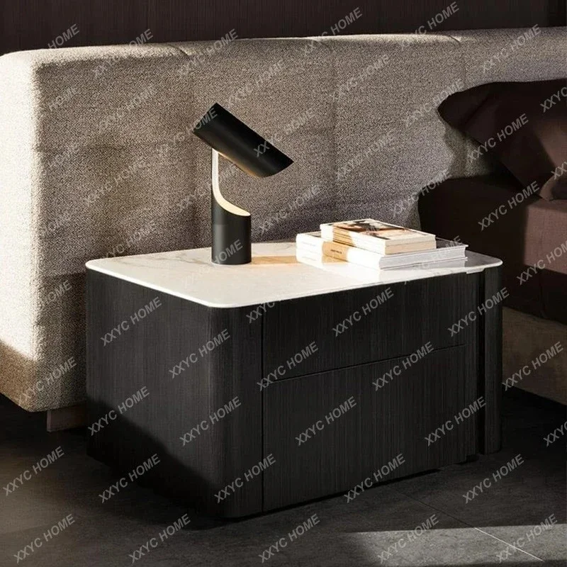 A  Italian light luxury rock slab bedside table high-end special-shaped drawer locker