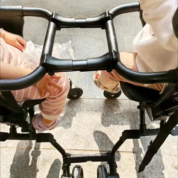 รถเข็นเด็กฝาแฝดตัวต่อข้อต่อสากลรถเข็นเด็กทารกตะขอเกี่ยวสายรัดปรับได้เพื่อความปลอดภัยอุปกรณ์เสริมสำหรับรถเข็นเด็กทารก