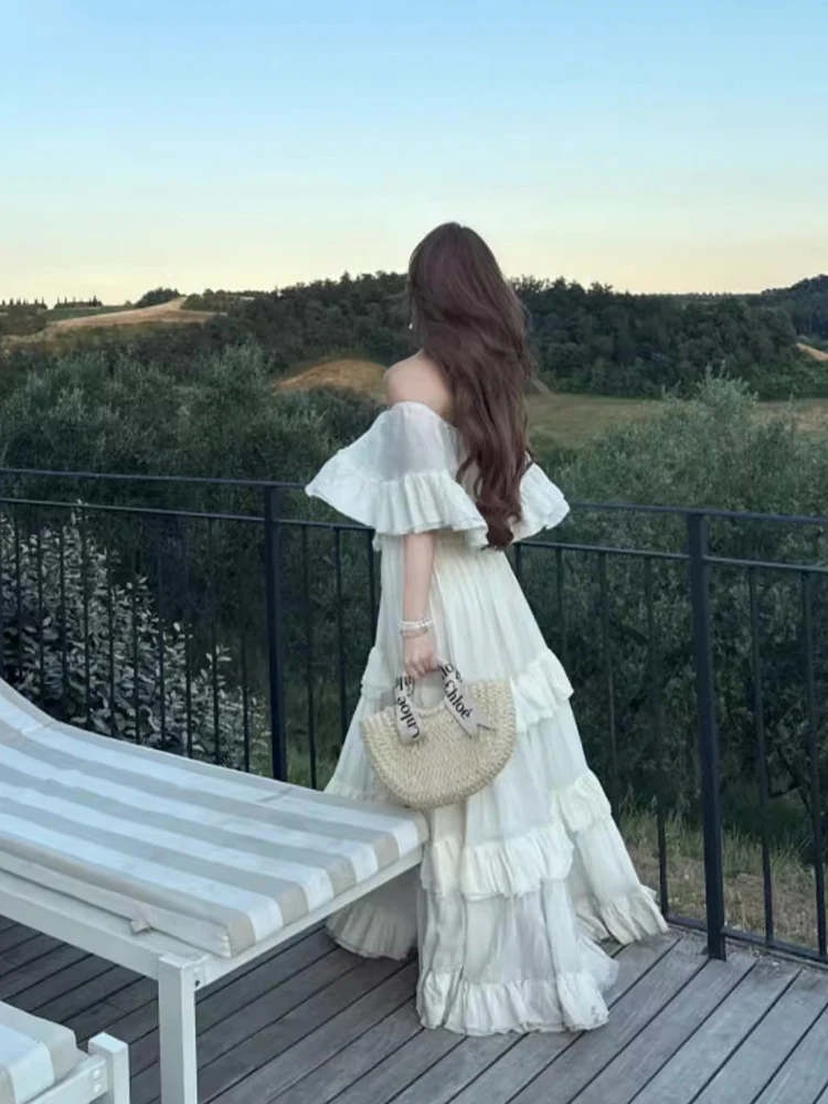 เดรสยาวทรงเอไลน์สำหรับผู้หญิง ReddaChic รุ่นฤดูร้อน ผ้าพลิ้ว ไหล่เฉียง แต่งลูกไม้ฉลุลาย ระบายหลายชั้น สไตล์ลำลอง โบฮีเมียน เหมาะสำหรับใส่ไปชายหาด