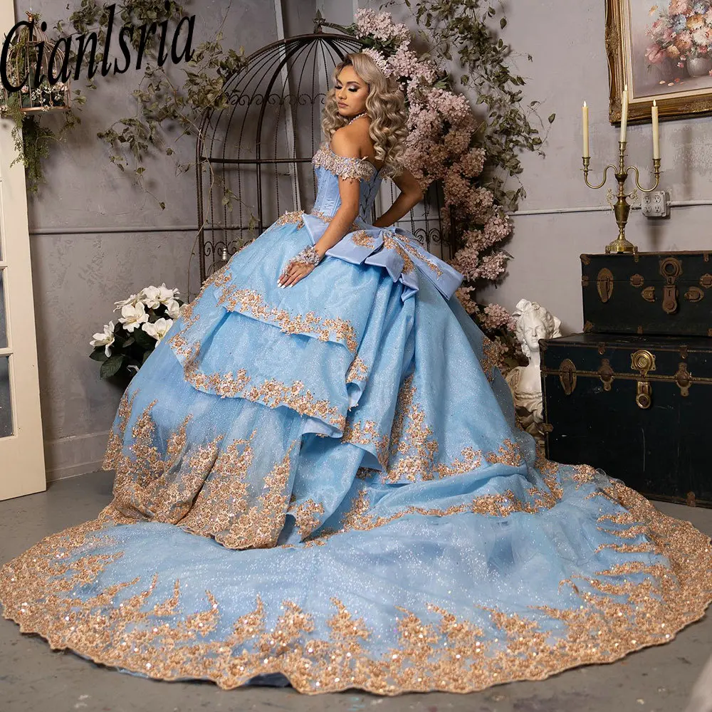 

Light Blue Glitter Crystal Ruffles Mexican Quinceanera Dress Ball Gown Gold Appliques Lace Corset Vestidos De XV Anos