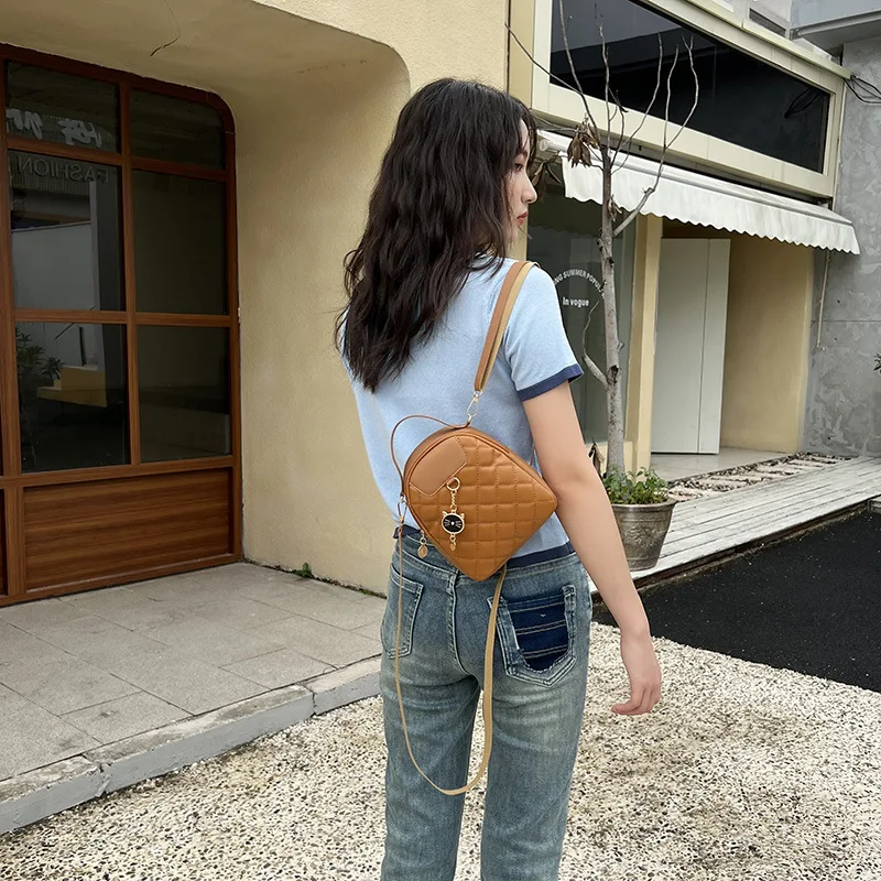 2023 New Fashionable and Magnificent Lingge Embroidered Cat Head Pendant Backpack Personalized Small One Shoulder Crossbody Bag