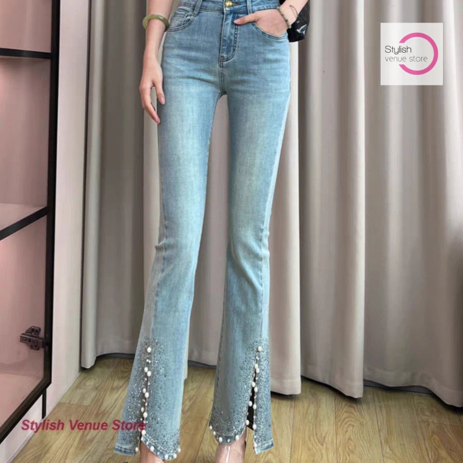 Korean-style fashion rhinestone denim flared pants women's autumn and winter new temperament split design high waist slim pants.