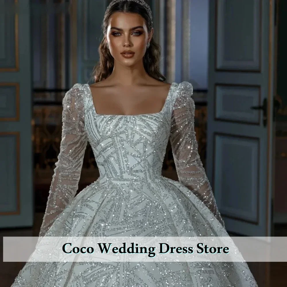 فستان زفاف رائع مخصص برقبة مربعة مزين بالترتر اللامع وأكمام طويلة فستان العروس فيستدو دي نوفيا