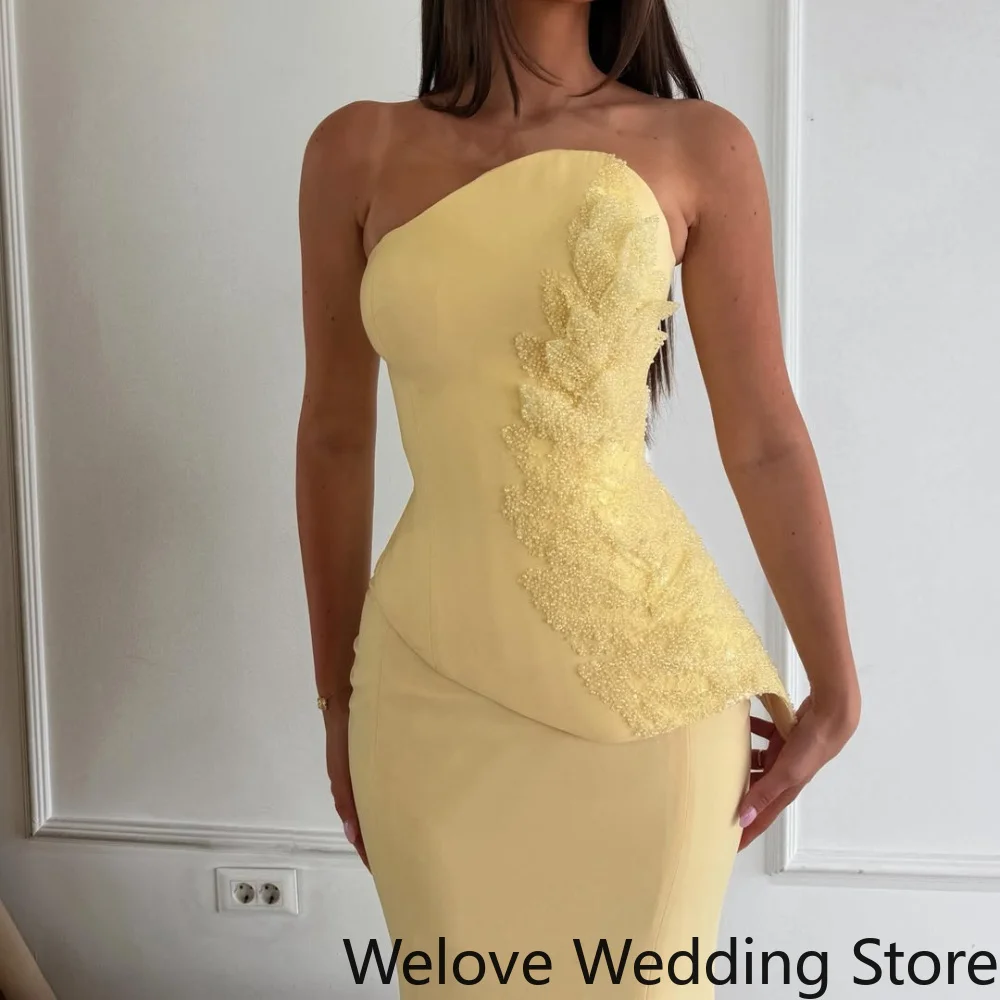 Bright Yellow Formal Evening Gown featuring a sleek strapless design, an asymmetrical neckline and a fitted corset-style bodice
