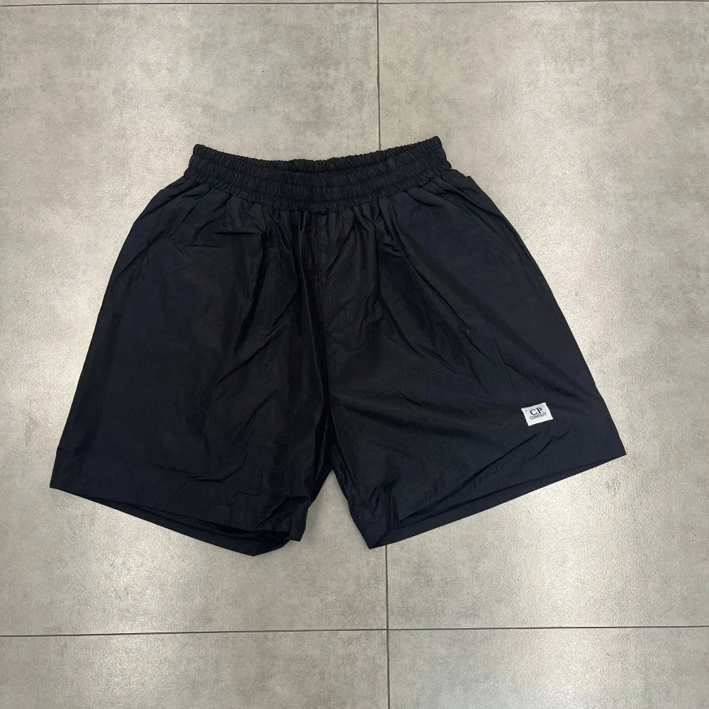 شورت صيفي أوروبي وأمريكي CP مطبوع عليه حروف شورت ثلاثي الأبعاد مناسب لكل من الرجال والنساء