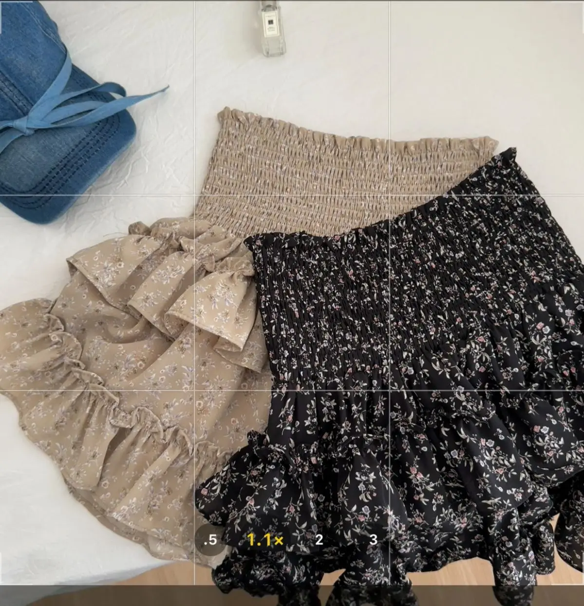 กระโปรงดอกไม้ใหม่ยืดหยุ่นฤดูใบไม้ผลิและฤดูร้อนเค้กกลุ่มเอวสูงกระชับสัดส่วนหน้าท้องกระโปรงสั้นสีดํา