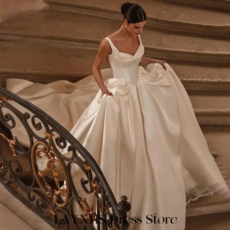 LAYXHS فساتين زفاف كريمة السباغيتي الأشرطة اللؤلؤ ألف خط الطية الطابق زي العرائس مخصص رداء دي ماري
